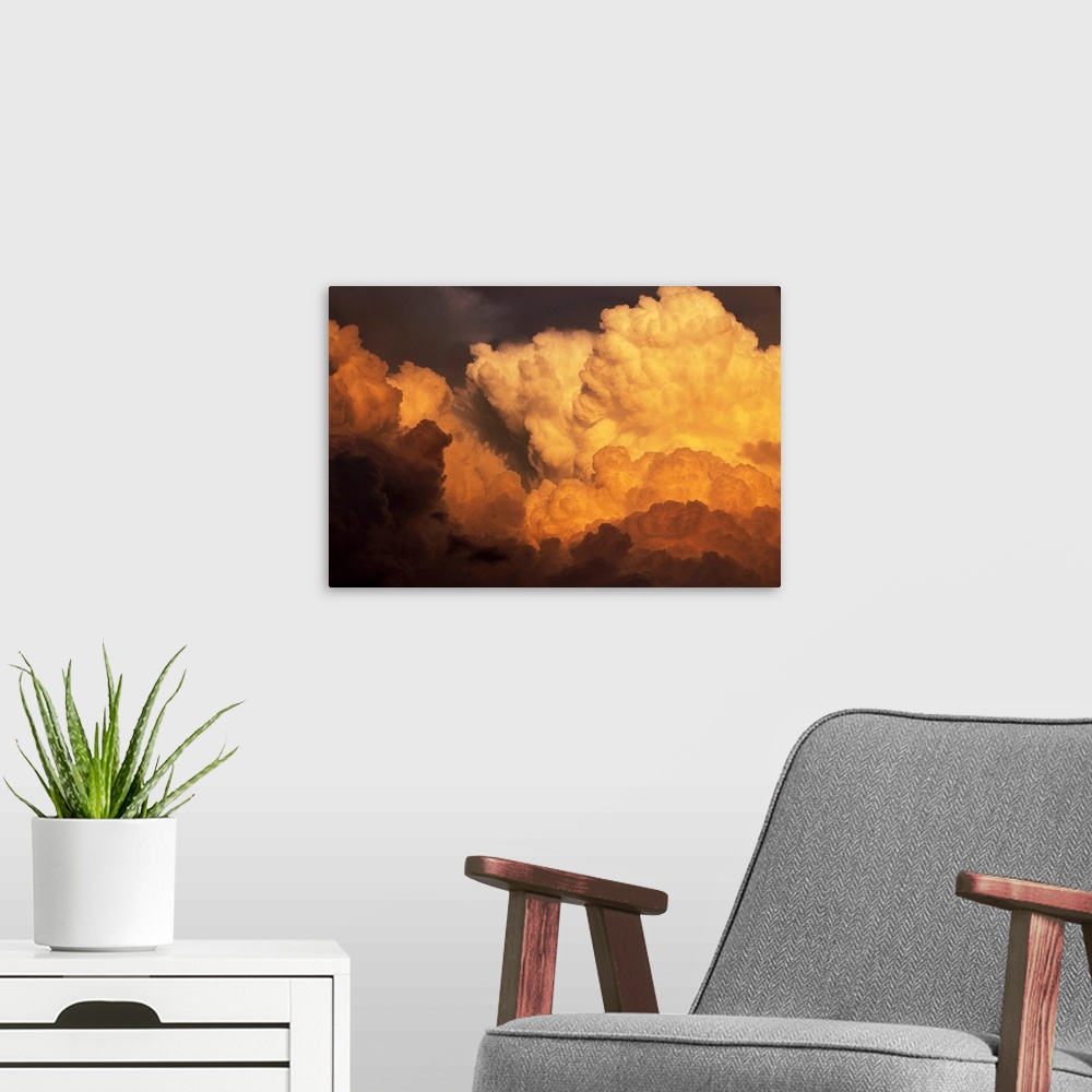 A modern room featuring Sunlight hits a massive swell of cumulonimbus clouds looming over Texas. | Location: Above Sweetw...