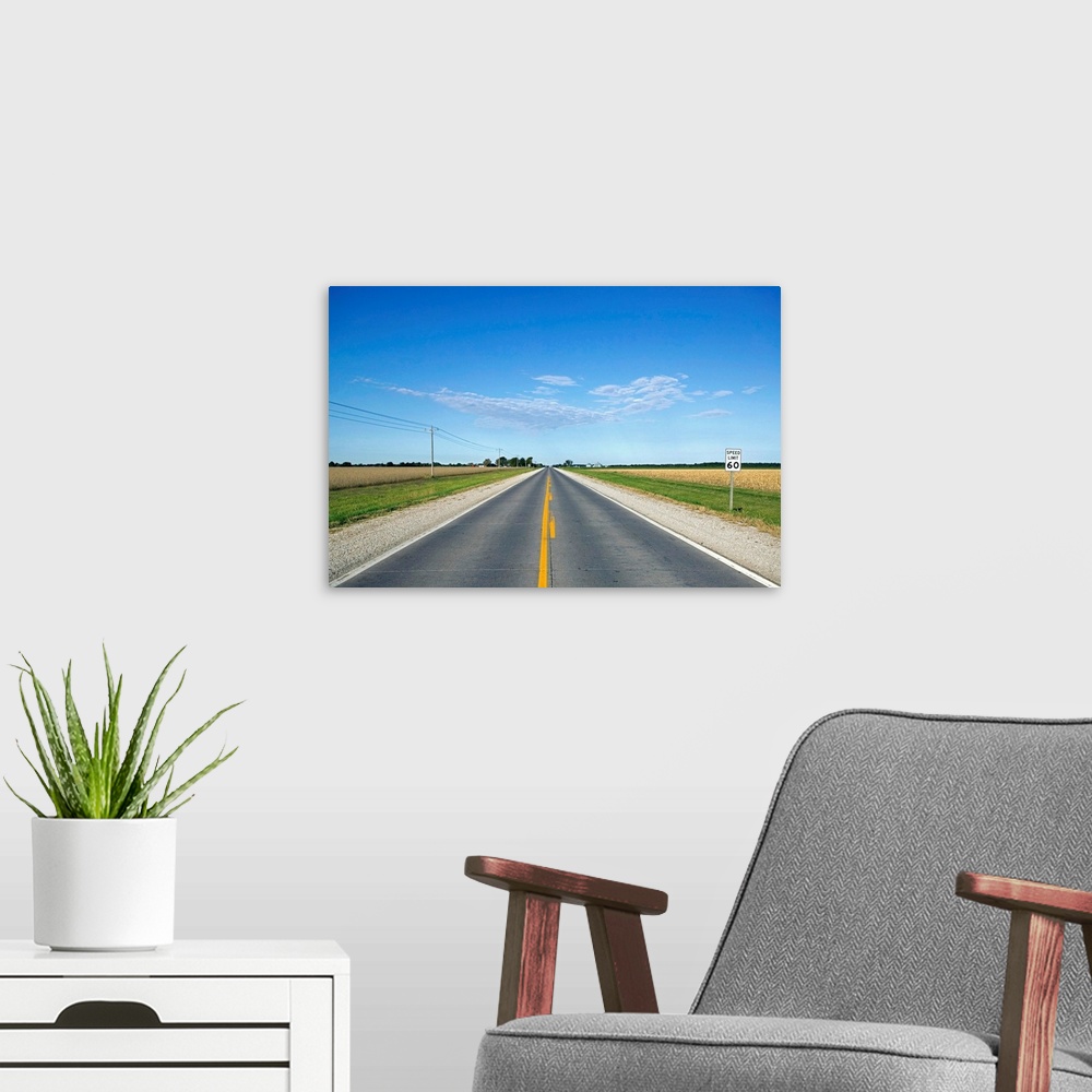 A modern room featuring Open road through farmland of the midwest USA