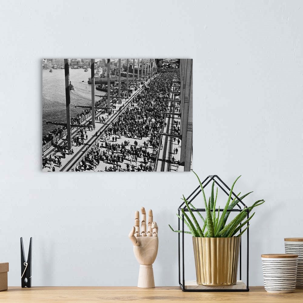 A bohemian room featuring Crowds crossing Sydney Harbour Bridge for the opening celebration.