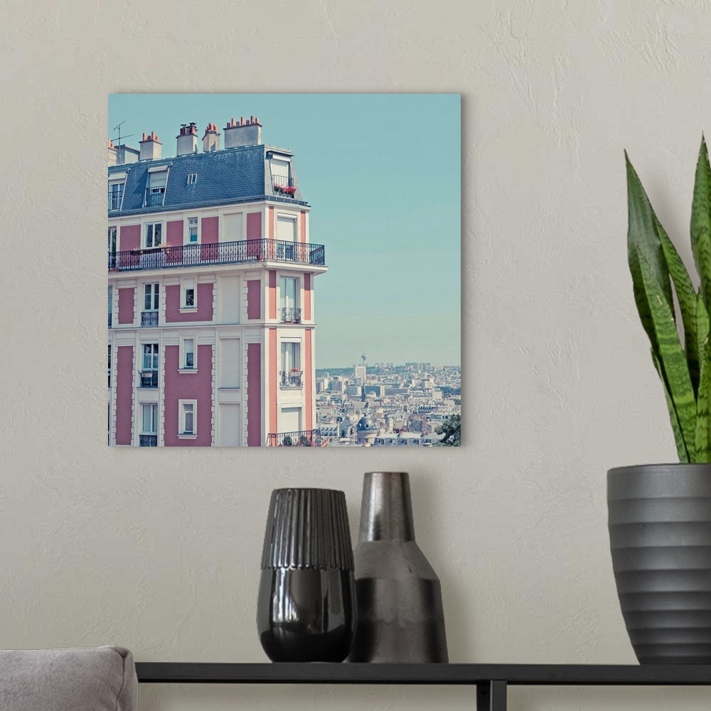 A modern room featuring Orange apartment building with view over Paris, Montmartre, Paris, France.