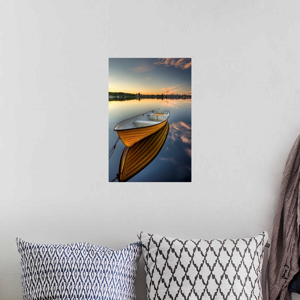 A bohemian room featuring Orange boat with strong reflection sunset in Karlstad, Sweden.