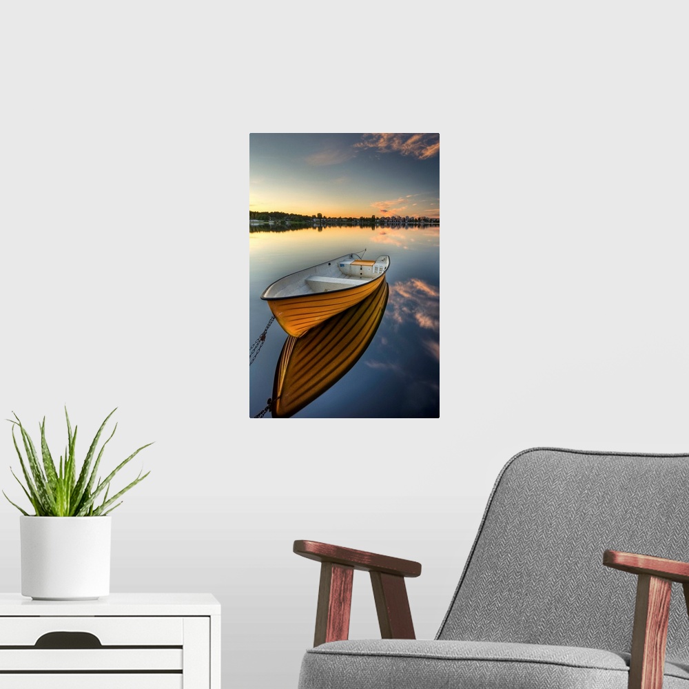 A modern room featuring Orange boat with strong reflection sunset in Karlstad, Sweden.