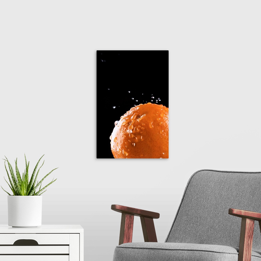 A modern room featuring Orange with water droplets splashing