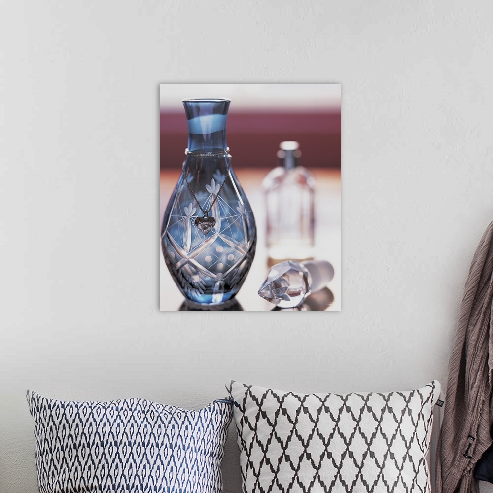 A bohemian room featuring Ornate Perfume Bottle with Heart Shaped Necklace