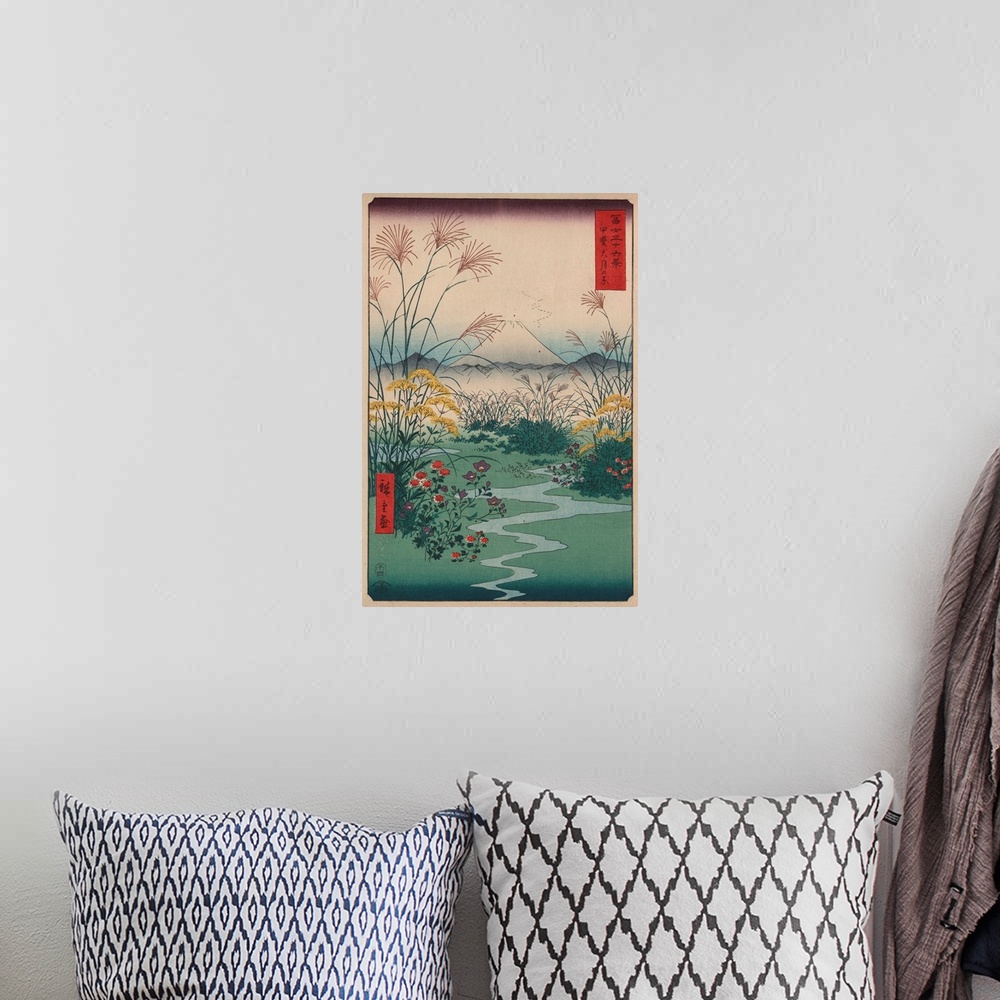 A bohemian room featuring A print from the series Thirty-Six Views of Mount Fuji by Hiroshige.