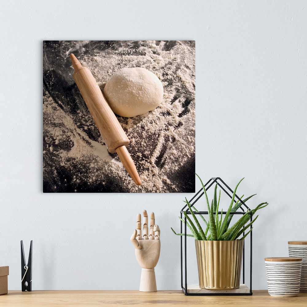 A bohemian room featuring Overhead shot of a rolling pin, dough and flour on a counter
