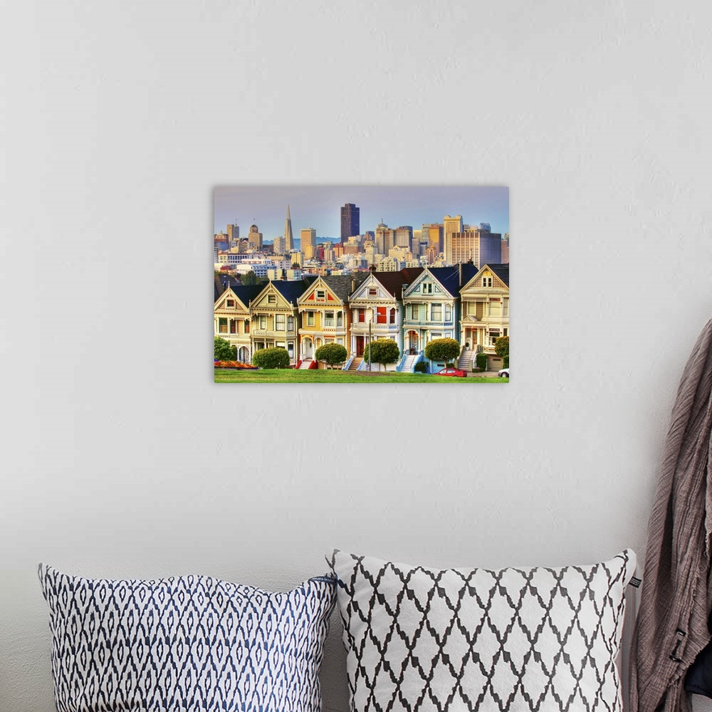 A bohemian room featuring This famous row of colorful Victorians known as the 'Painted Ladies', located at Alamo Square, we...