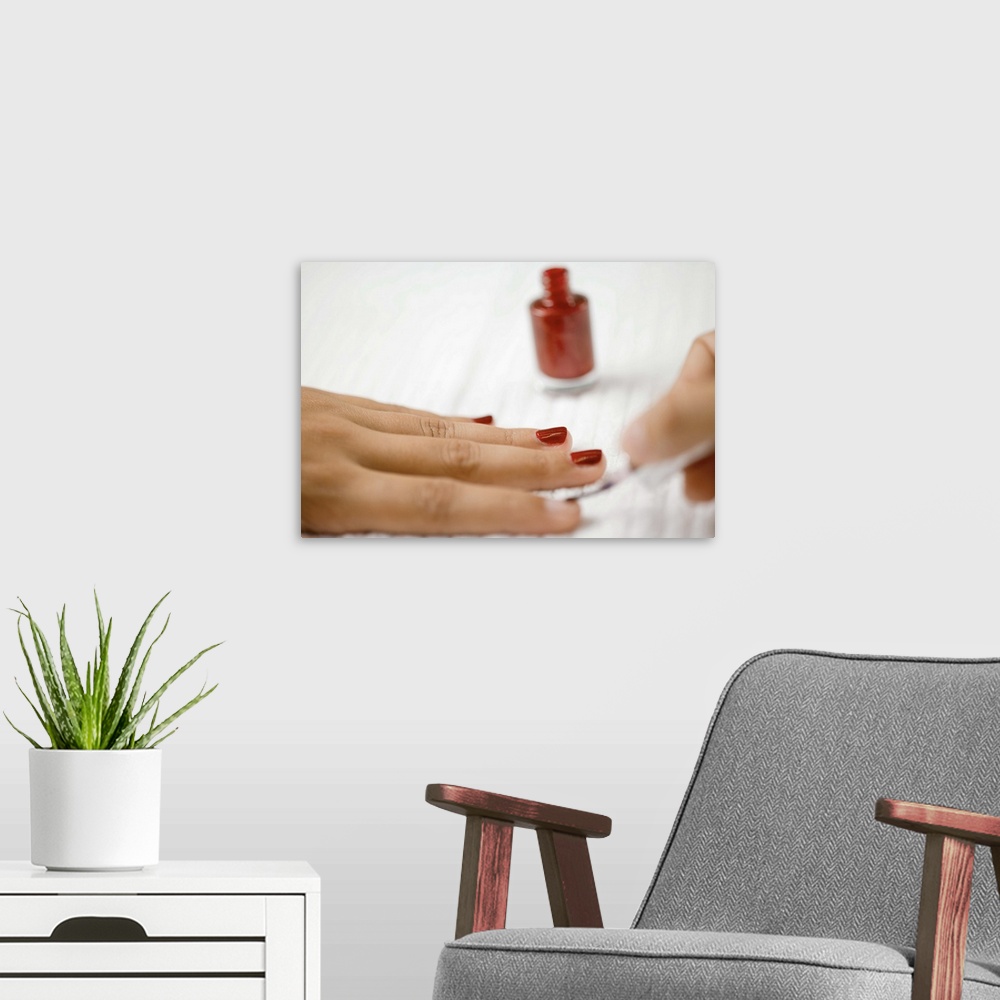 A modern room featuring Painting fingernails with nail polish