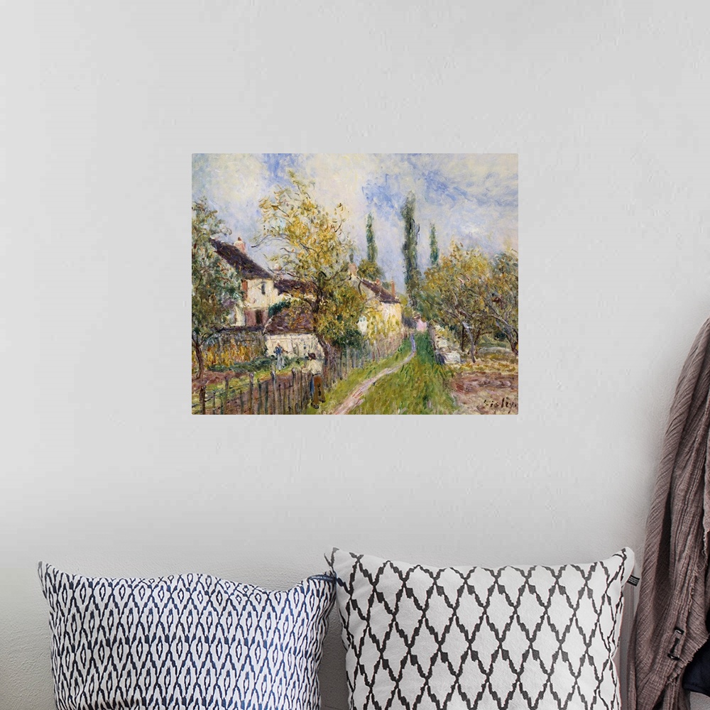 A bohemian room featuring Painting Of The French Countryside By Alfred Sisley