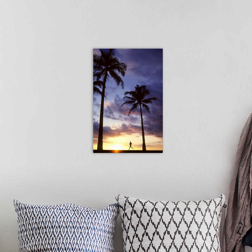 A bohemian room featuring Palm trees at sunset, Woman jogs past, captured while she is in midair.