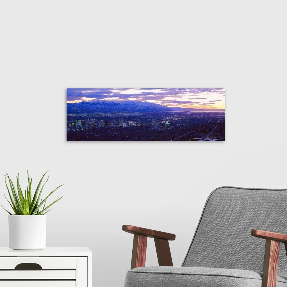 A modern room featuring Panoramic sunset of Salt Lake City with snow capped Wasatch Mountains