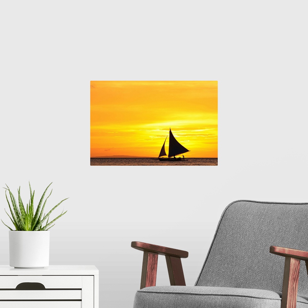 A modern room featuring Paraw sailing at sunset, Philippines.