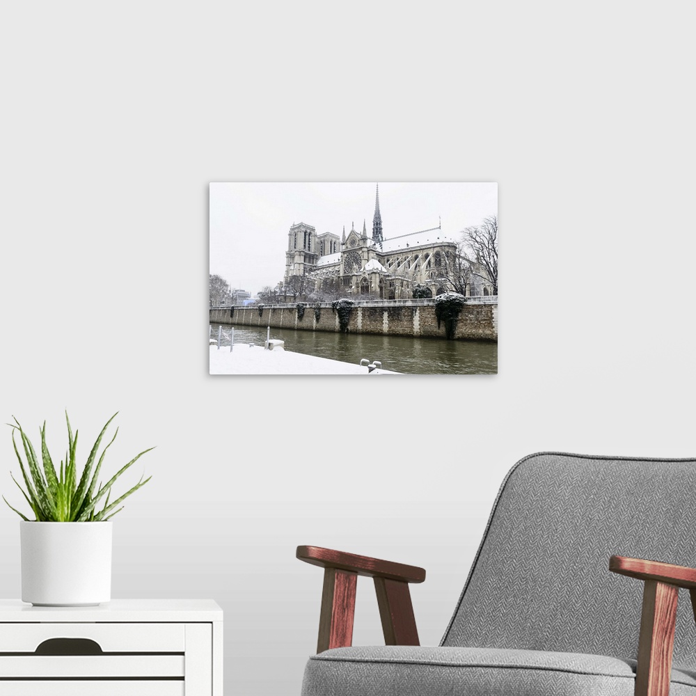 A modern room featuring Notre Dame, the great cathedral in the center of Paris. As seen from Quai de Montebello