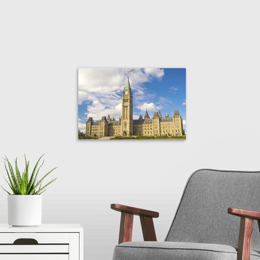 A modern room featuring Centre block of Parliament, on Parliament Hill.
