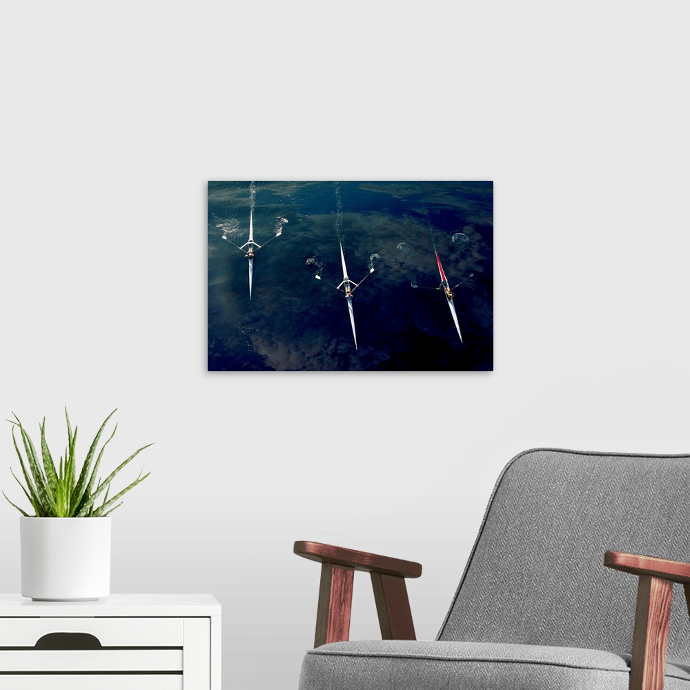 A modern room featuring People rowing sculling boats on river
