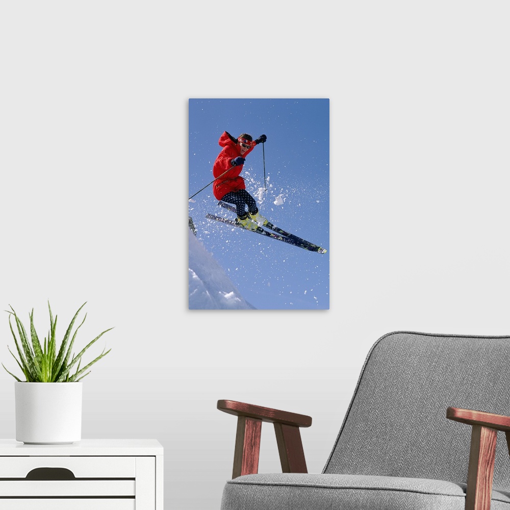 A modern room featuring Person downhill skiing  in mid-air
