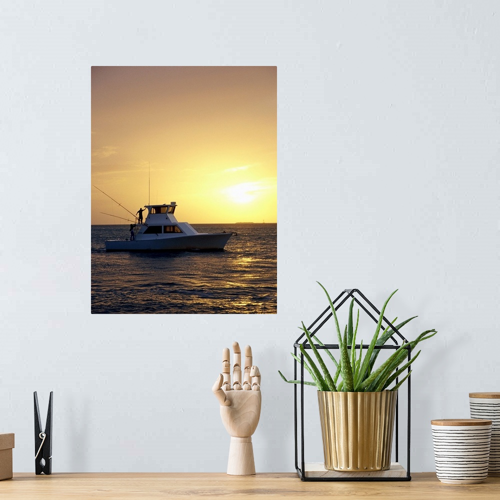 A bohemian room featuring Photo, Silhouette view of a fishing boat during sunset