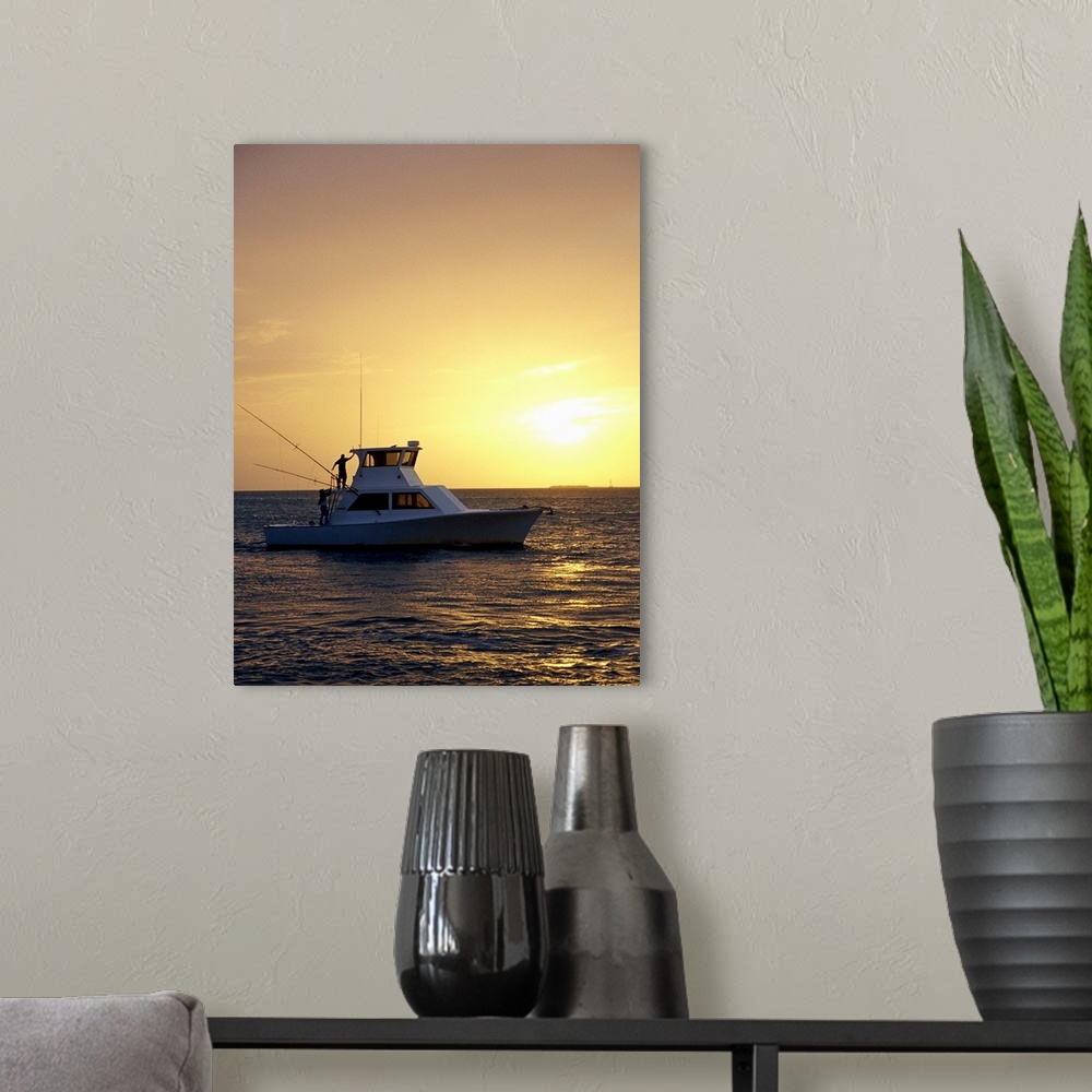 A modern room featuring Photo, Silhouette view of a fishing boat during sunset