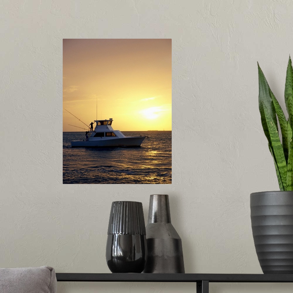 A modern room featuring Photo, Silhouette view of a fishing boat during sunset