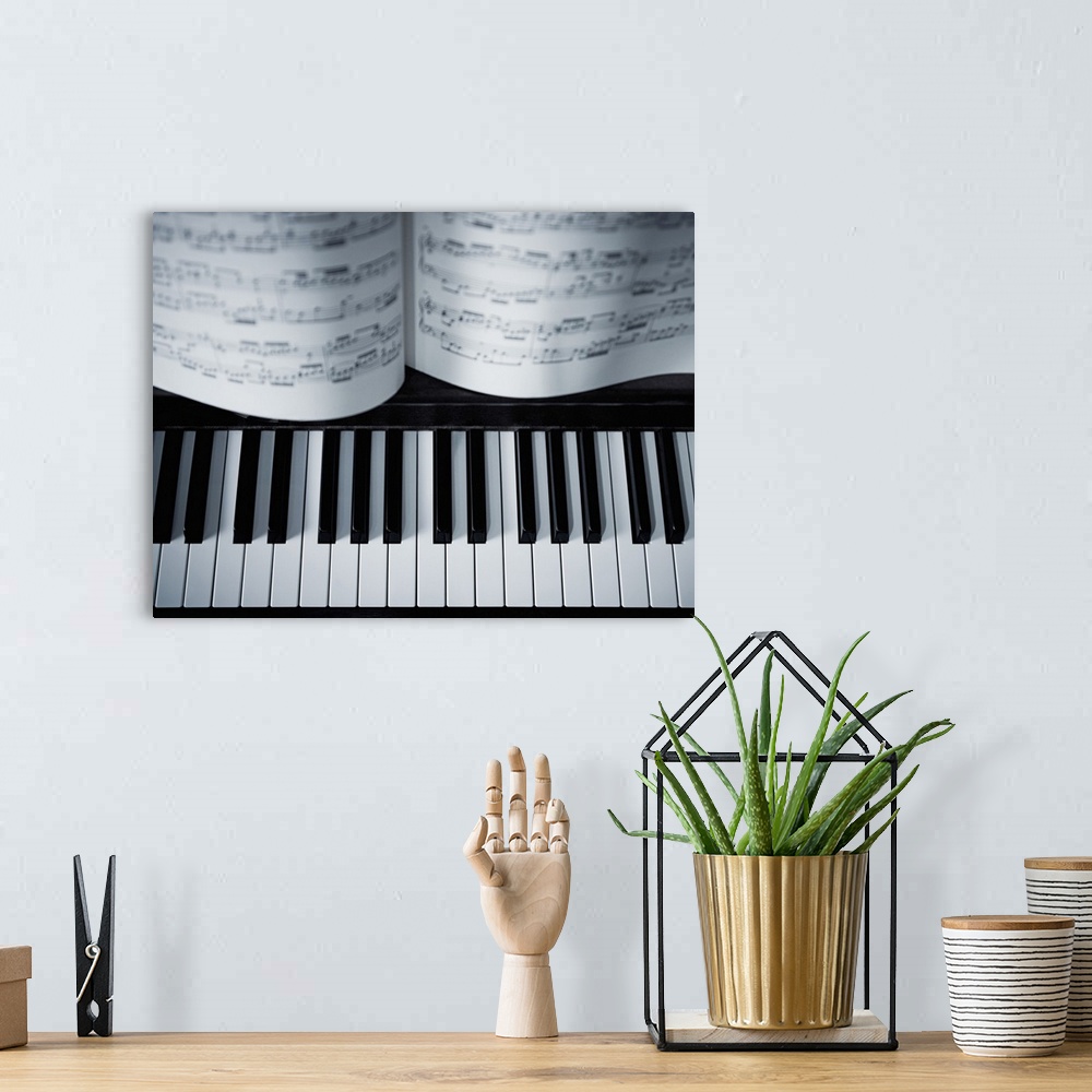 A bohemian room featuring Piano keys and music book detail.