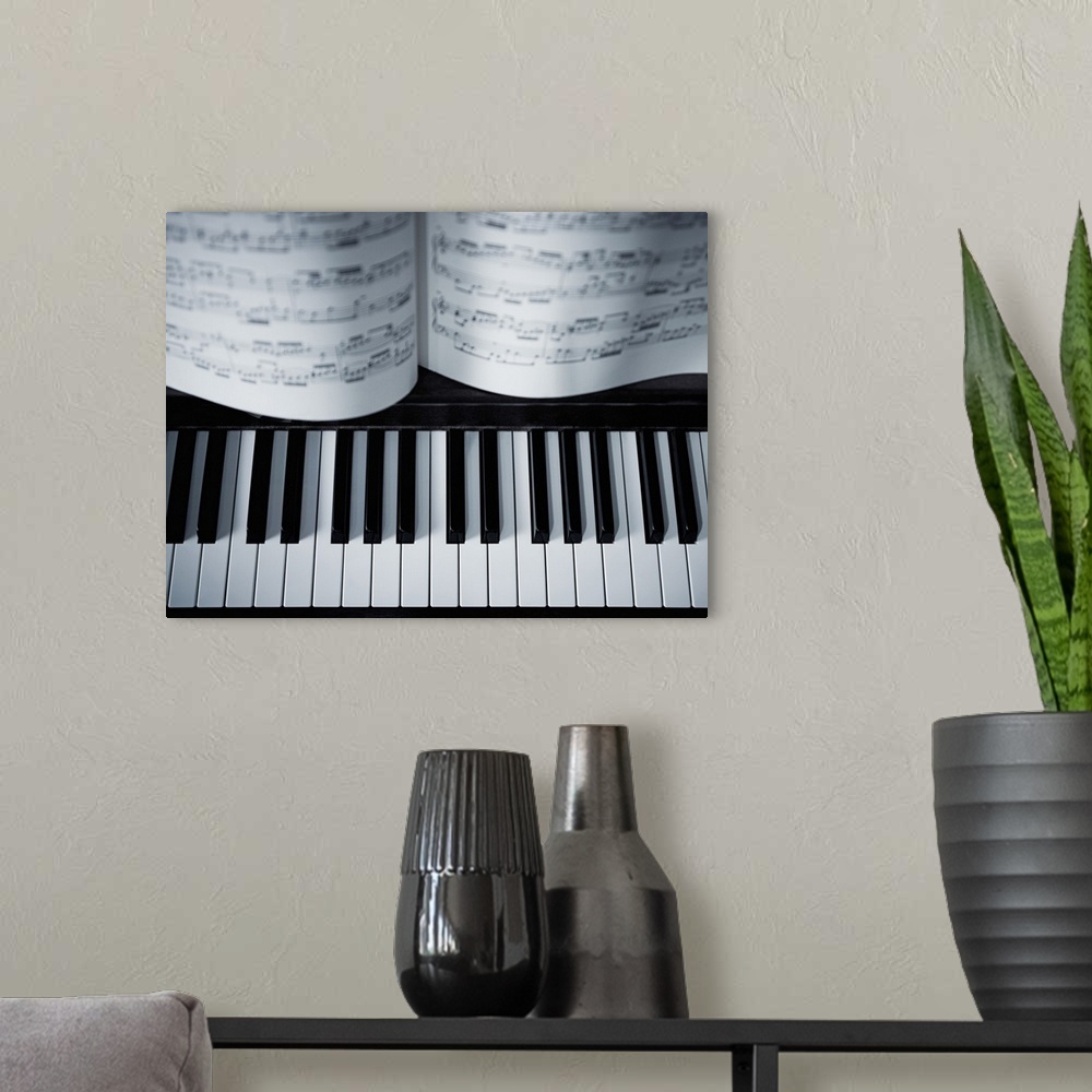 A modern room featuring Piano keys and music book detail.