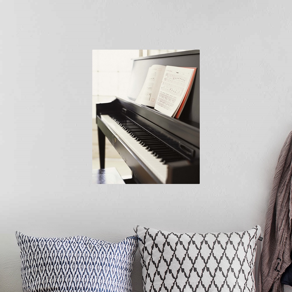 A bohemian room featuring Piano with sheet music