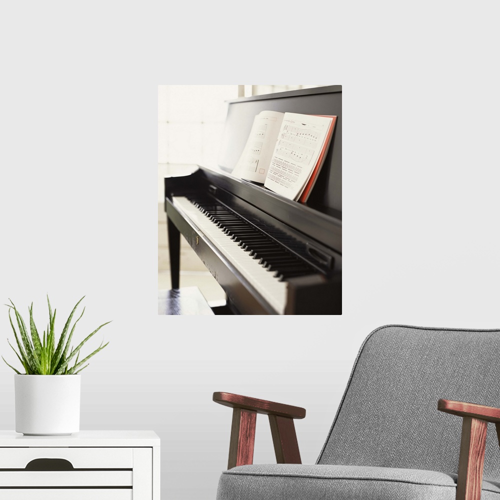 A modern room featuring Piano with sheet music