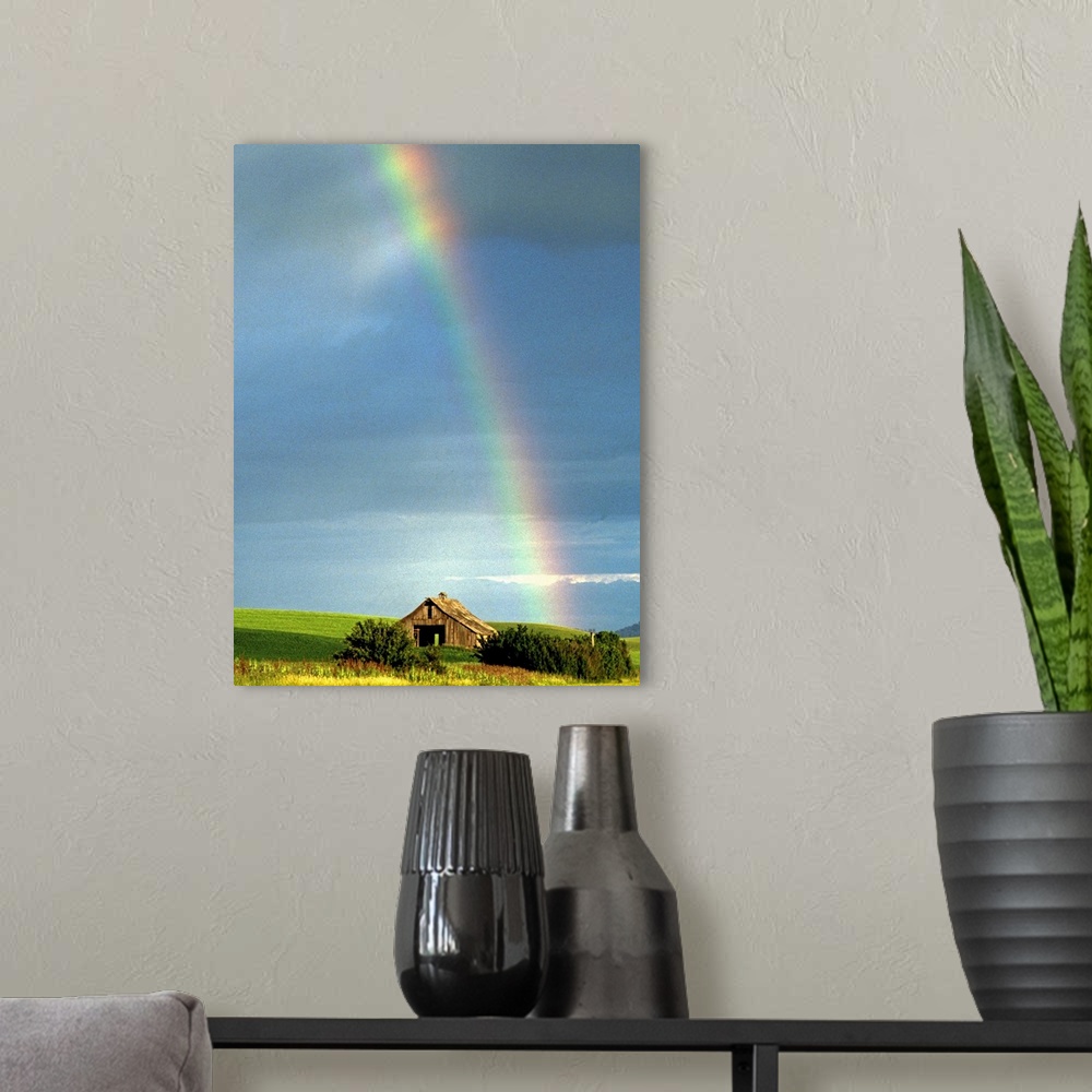 A modern room featuring Picturesque rainbow and rustic barn