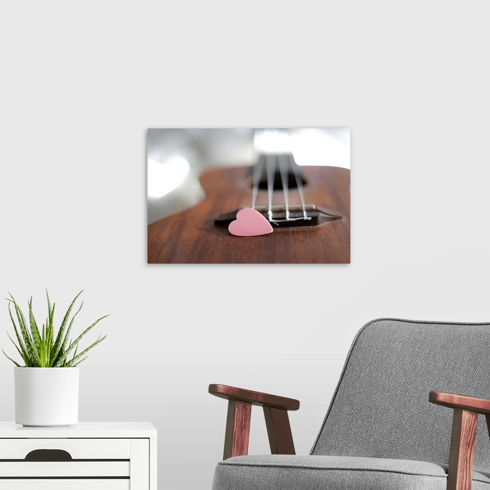 A modern room featuring Pink heart on guitar.