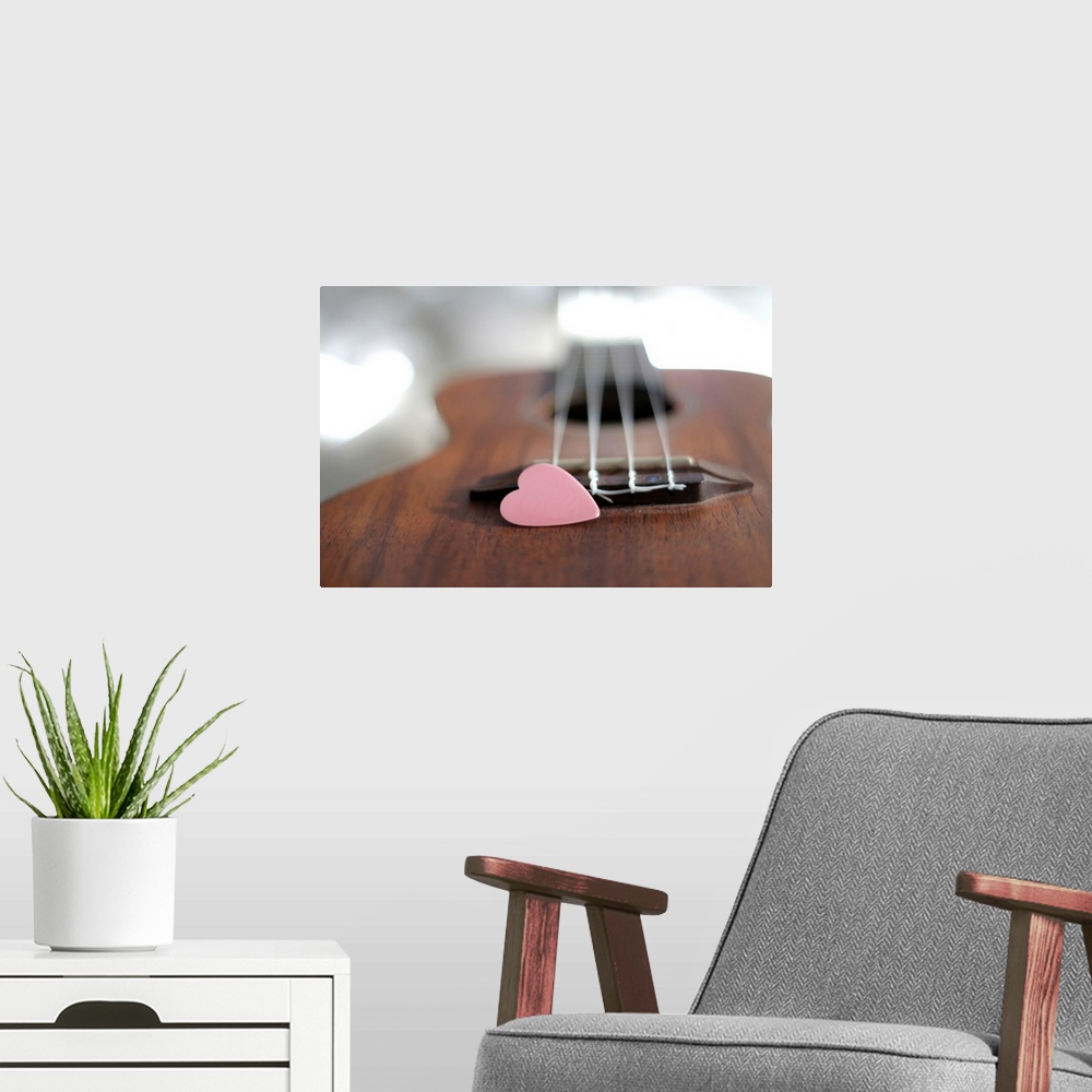 A modern room featuring Pink heart on guitar.