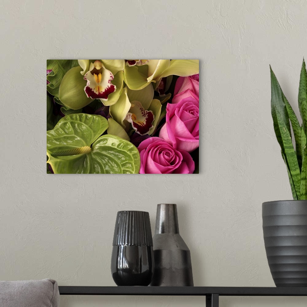 A modern room featuring Pink roses, green anthuriums, cymbidium orchids