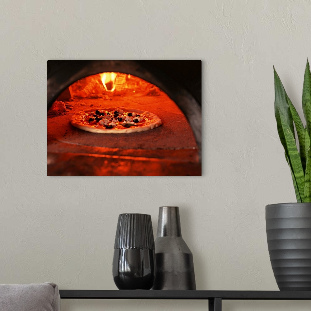 A modern room featuring Pizza baking in the forno