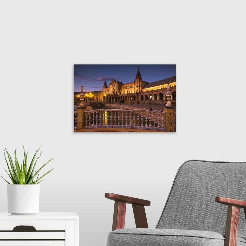 A modern room featuring Spain, Andalucia Region, Seville Province, Seville, Plaza de Espana buildings, evening