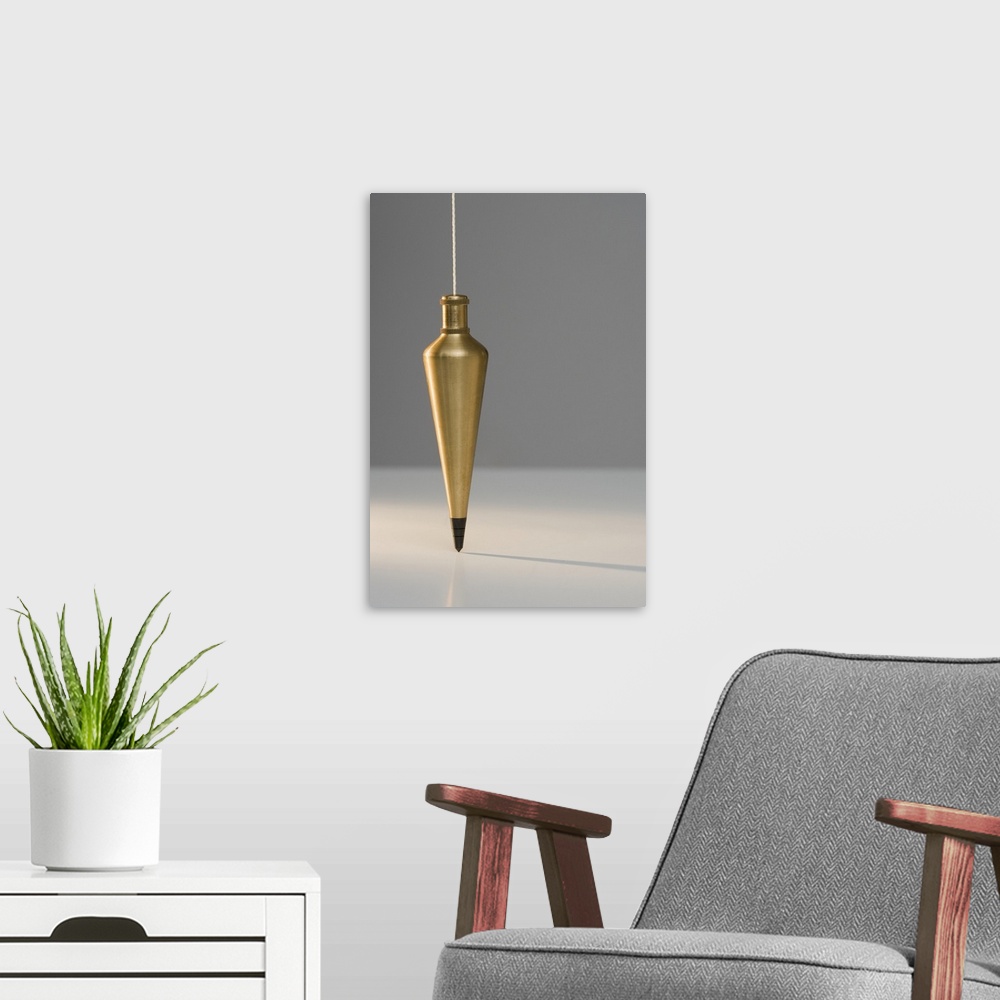 A modern room featuring Plumb bob suspended from plumb line