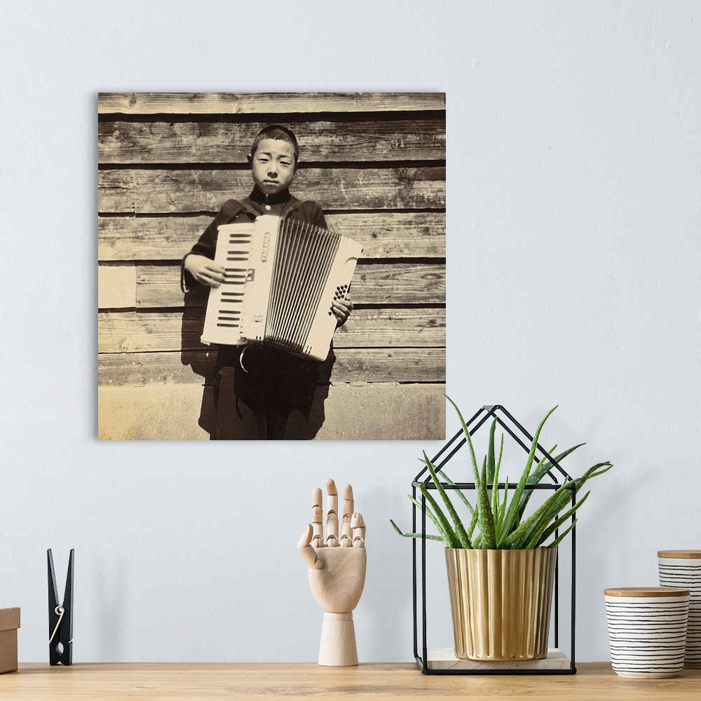 A bohemian room featuring Portrait of a Japanese student playing Accordion