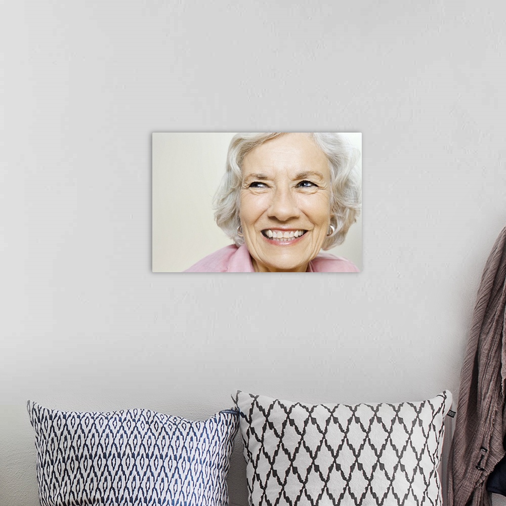 A bohemian room featuring Portrait of elderly woman grinning