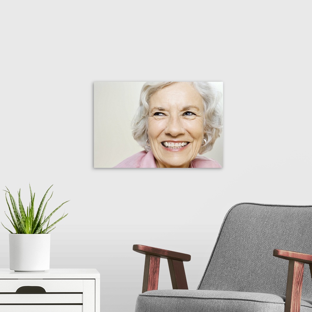 A modern room featuring Portrait of elderly woman grinning