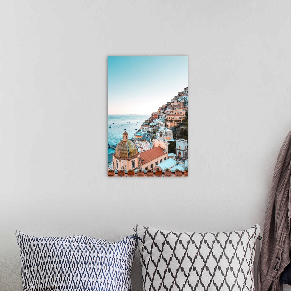 A bohemian room featuring View of the coastline and seaside from a colorful terrace on the Amalfi Coast in Italy.