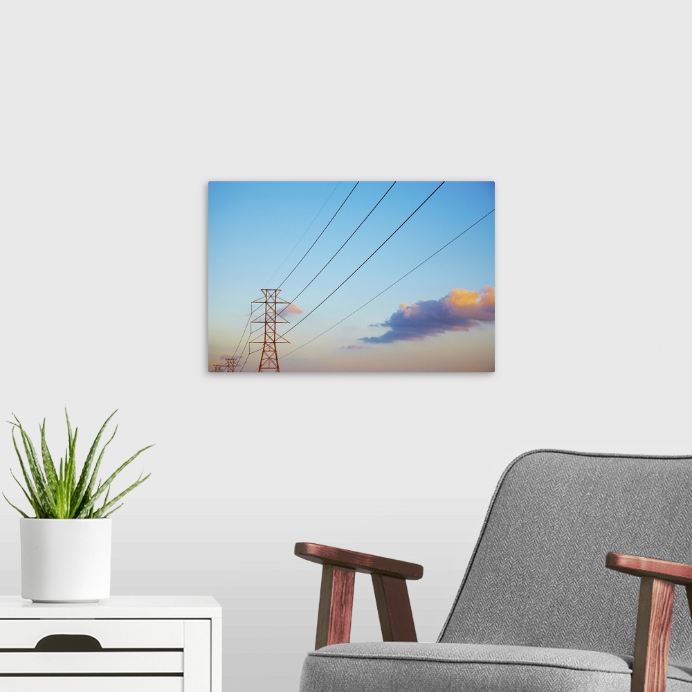 A modern room featuring Power lines and blue sky with clouds