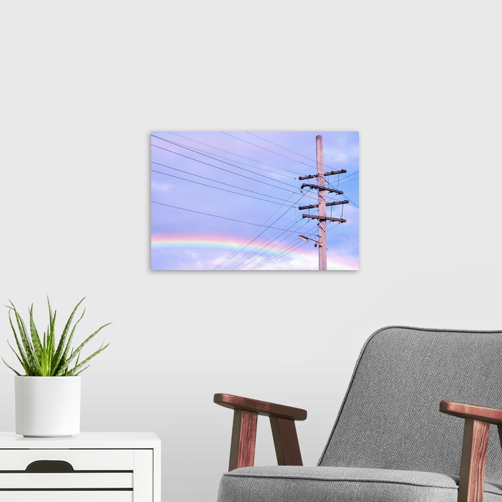 A modern room featuring Powerlines against rainbow sky.