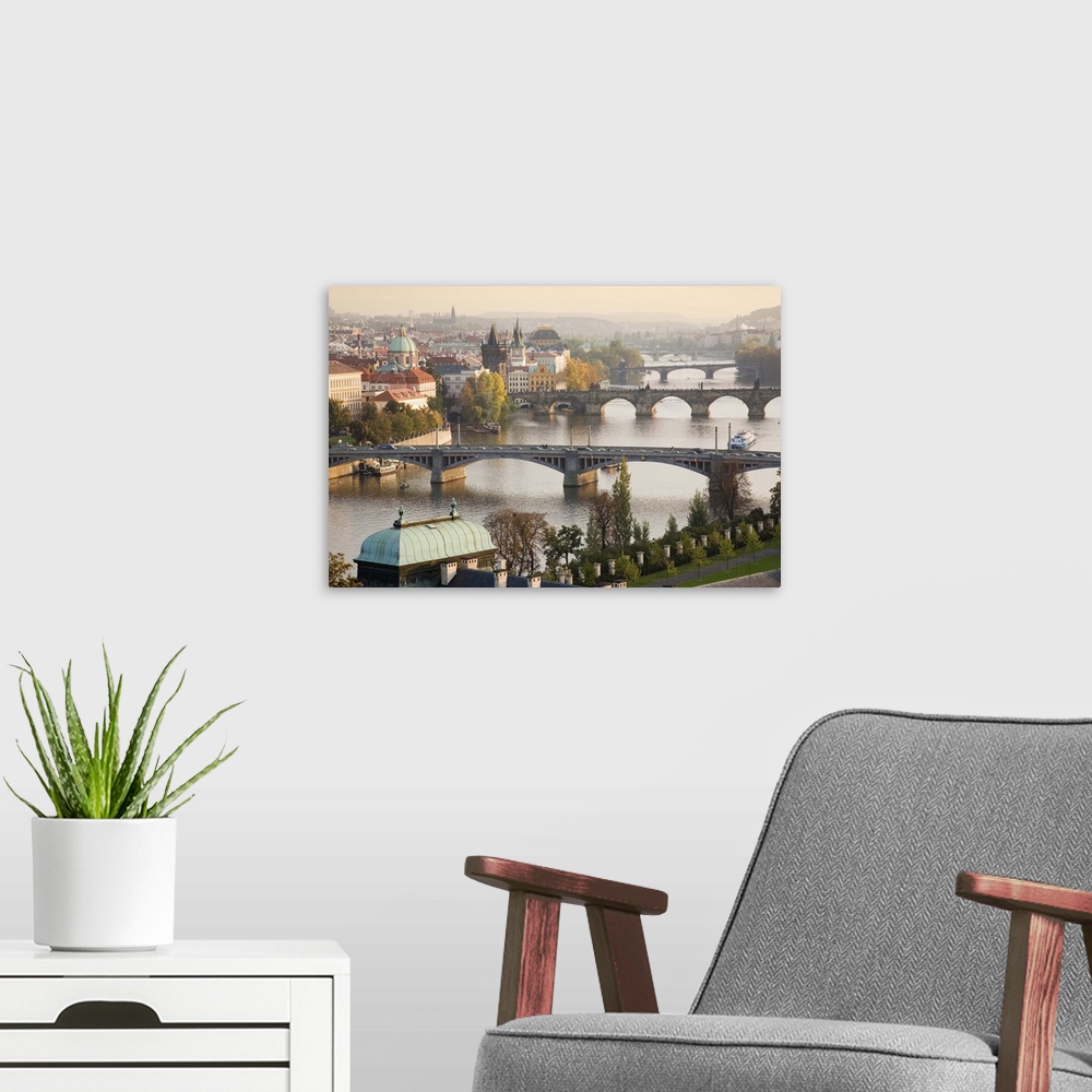 A modern room featuring Prague Cityscape with the Vltava River and its Bridges at sunset 2007.