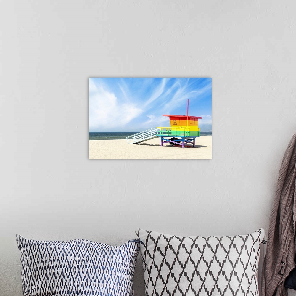 A bohemian room featuring A vibrant photo of a lifeguard tower in the colors of the pride flag, located at Venice Beach, Lo...