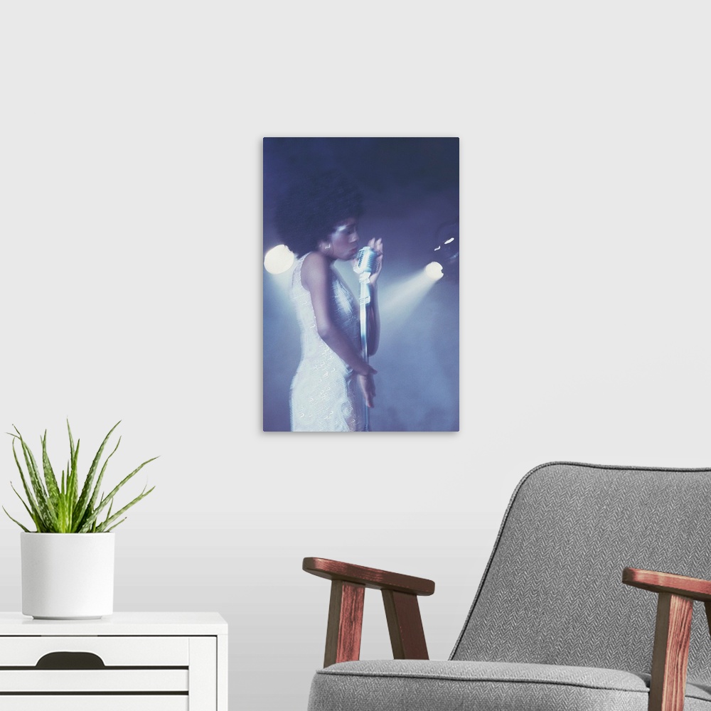 A modern room featuring Profile of female vocalist singing