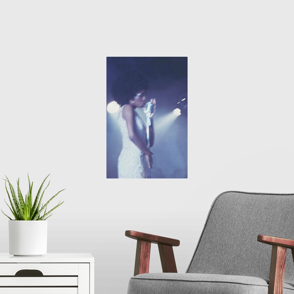 A modern room featuring Profile of female vocalist singing