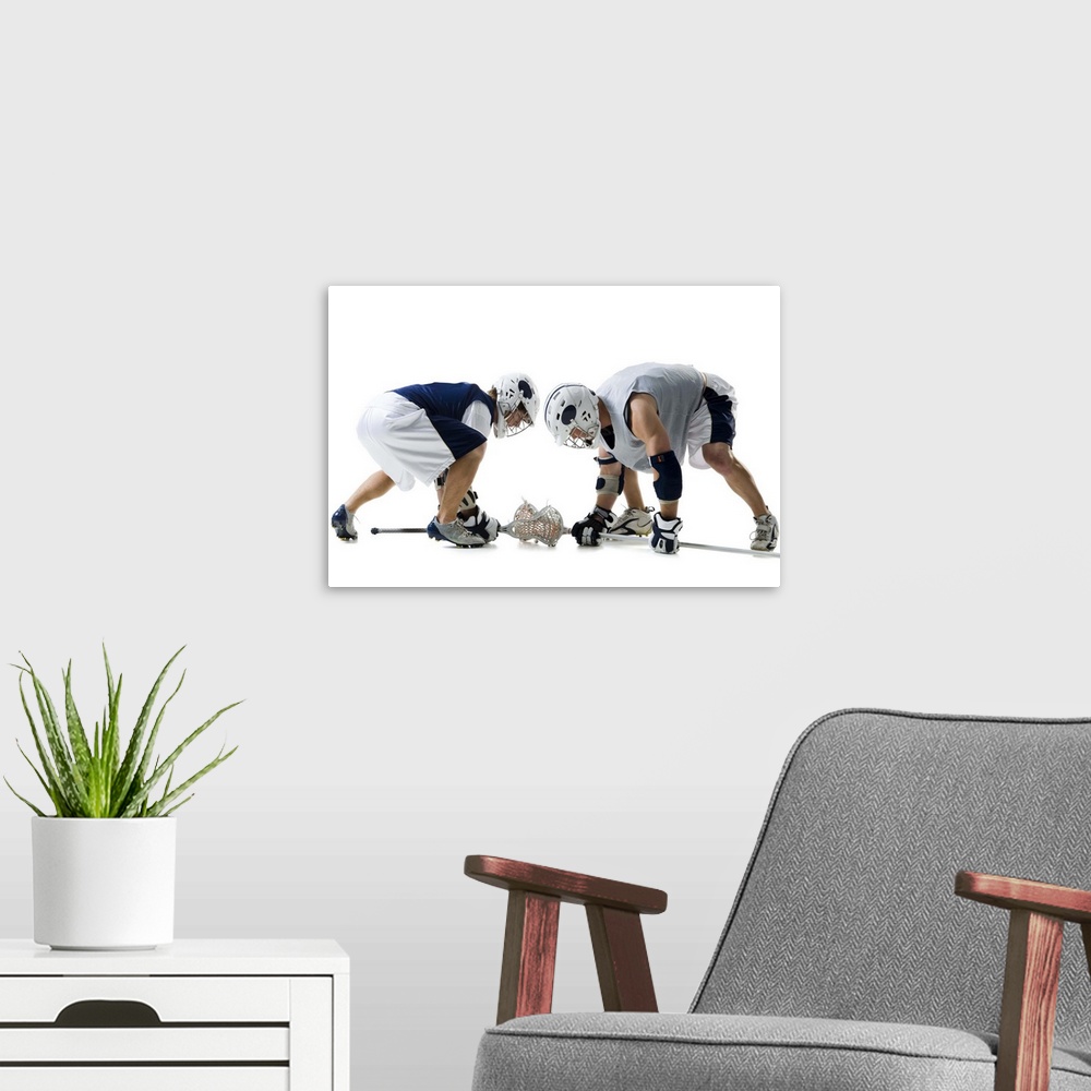 A modern room featuring Profile of two young men playing lacrosse
