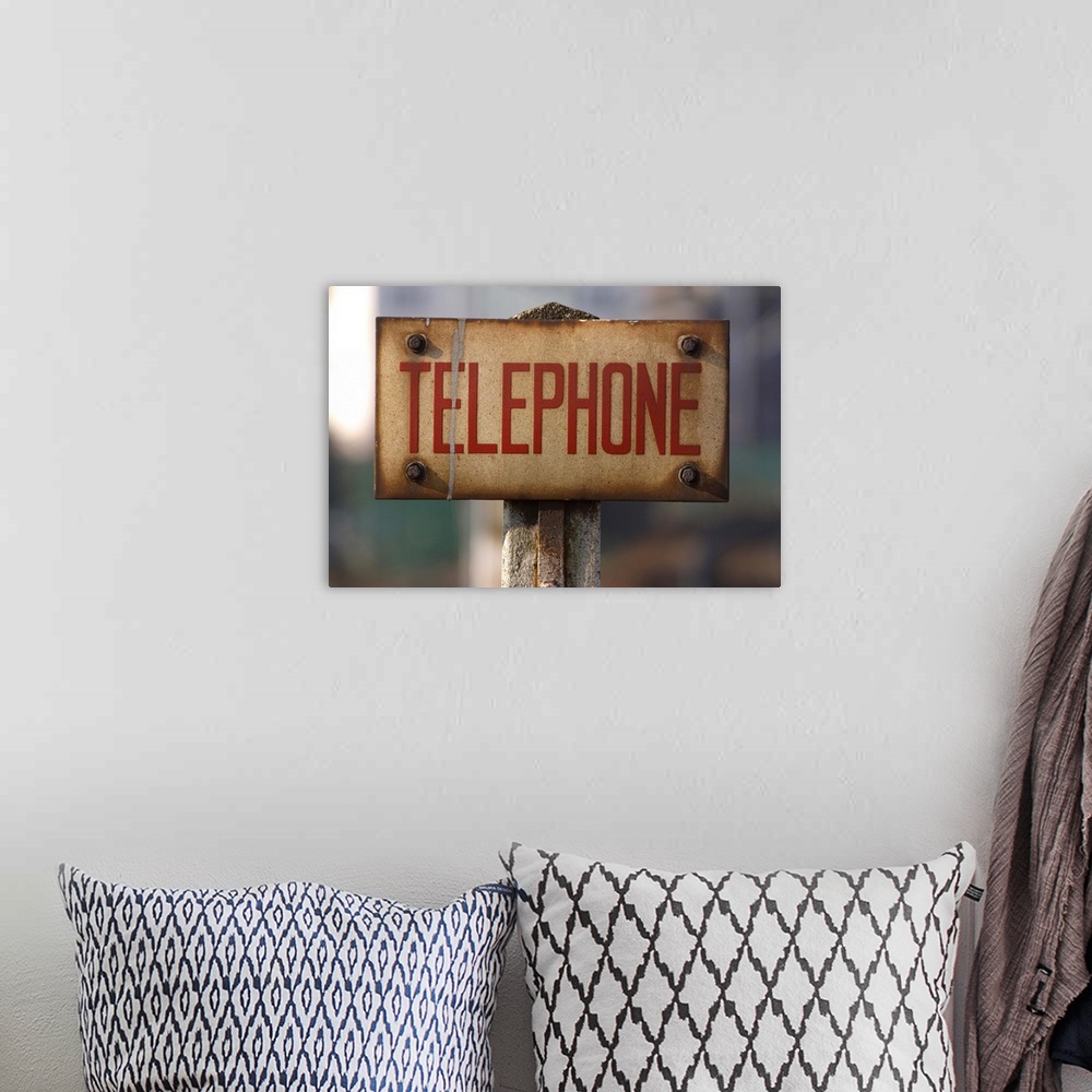 A bohemian room featuring Public telephone sign