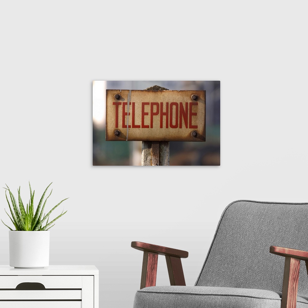 A modern room featuring Public telephone sign