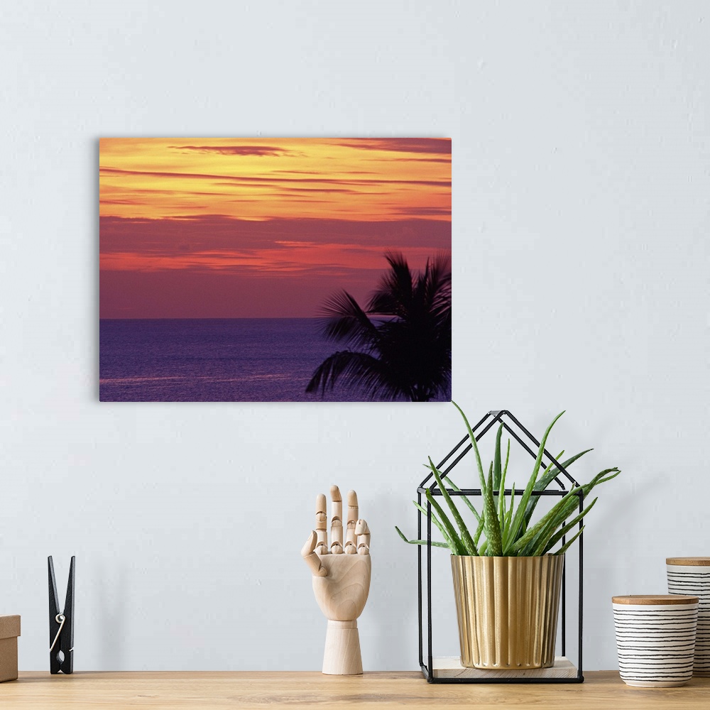 A bohemian room featuring Purple sea with orange sunset