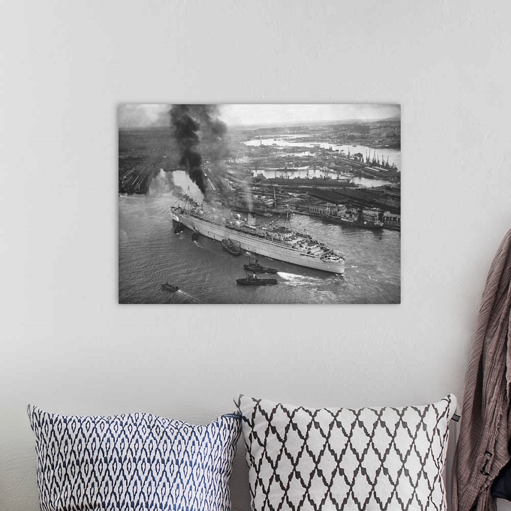 A bohemian room featuring An Aerial View Of Southampton Docks Showing The Giant Cunarder Queen Mary Docking.