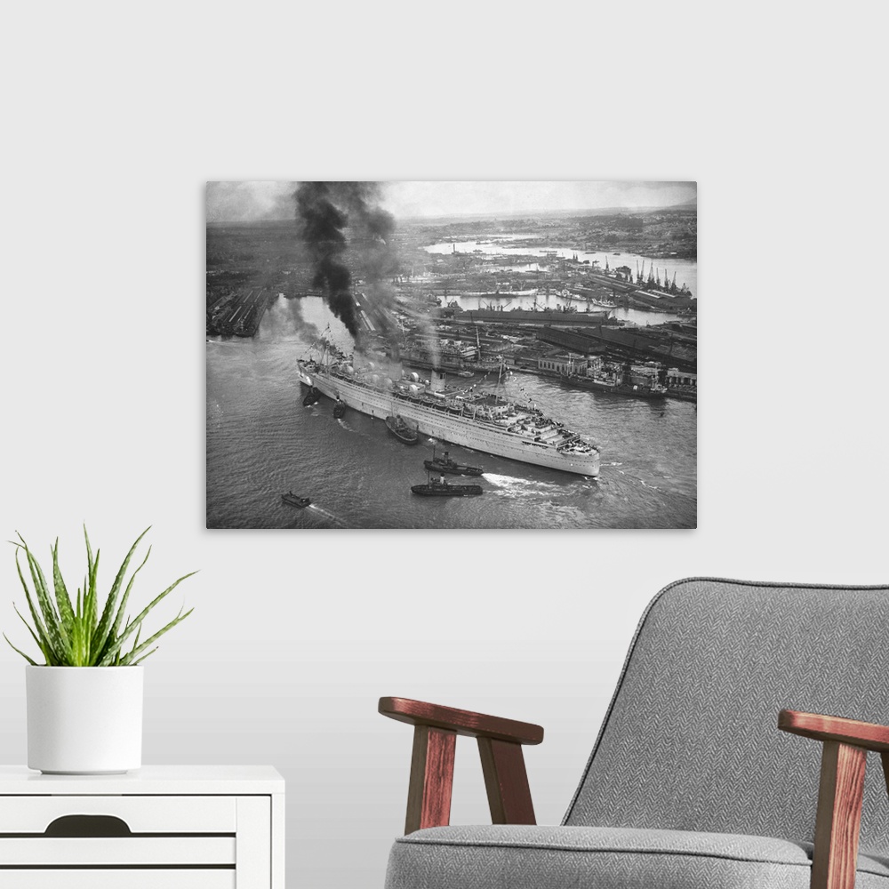 A modern room featuring An Aerial View Of Southampton Docks Showing The Giant Cunarder Queen Mary Docking.